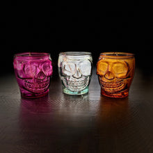 Load image into Gallery viewer, Skull jar image- left to right maroon skull, clear skull, orange skull